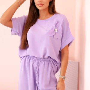 Moteriškas iš viskozės su dekoratyviniu gėlių raštu ir platėjančiomis kelnėmis - šviesiai